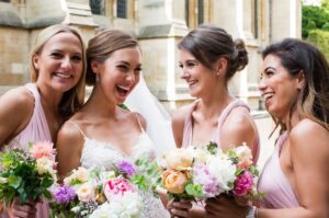 A bride with her bridesmaids at her wedding.