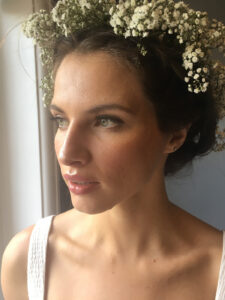 Pretty dark-haired bride with a crown of flowers.