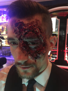 Gore makeup on a male bartender for Halloween party.