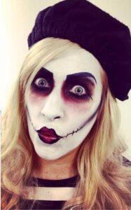 A woman with scary mime artist makeup.
