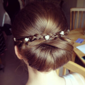 Neat bridal hair style with accessories.