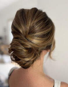An attractive low bun bridal hairstyle.