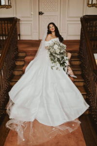 A beautiful bride on the stairs.