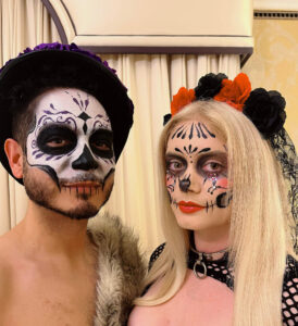 A couple with sugar skull Halloween makeup.