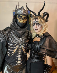 A couple with dark scary Halloween makeup.