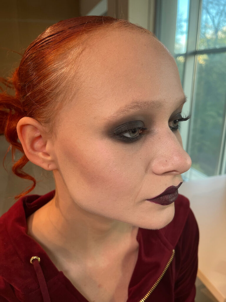 A girl with Tim Burton style makeup.