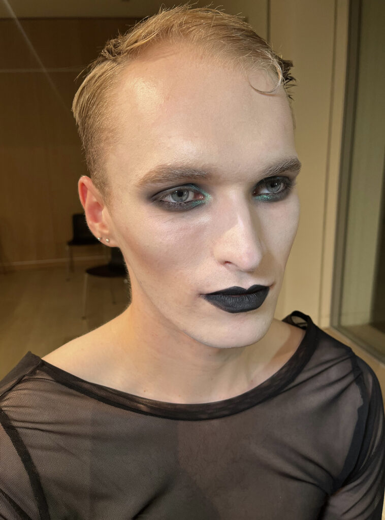 A man with Tim Burton style makeup.