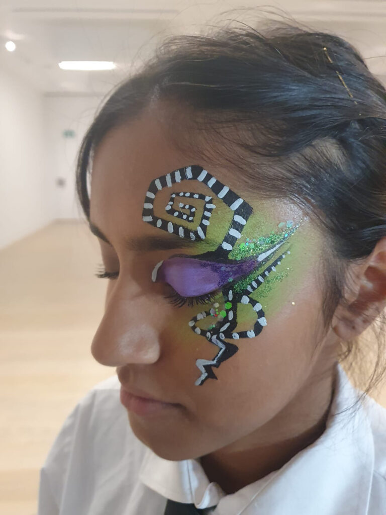 A girl with Tim Burton style makeup.