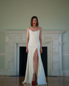 Elegant dark-haired bride with red lips and white dress.