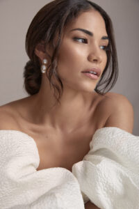 Dark-haired bride with off-the-shoulder dress.